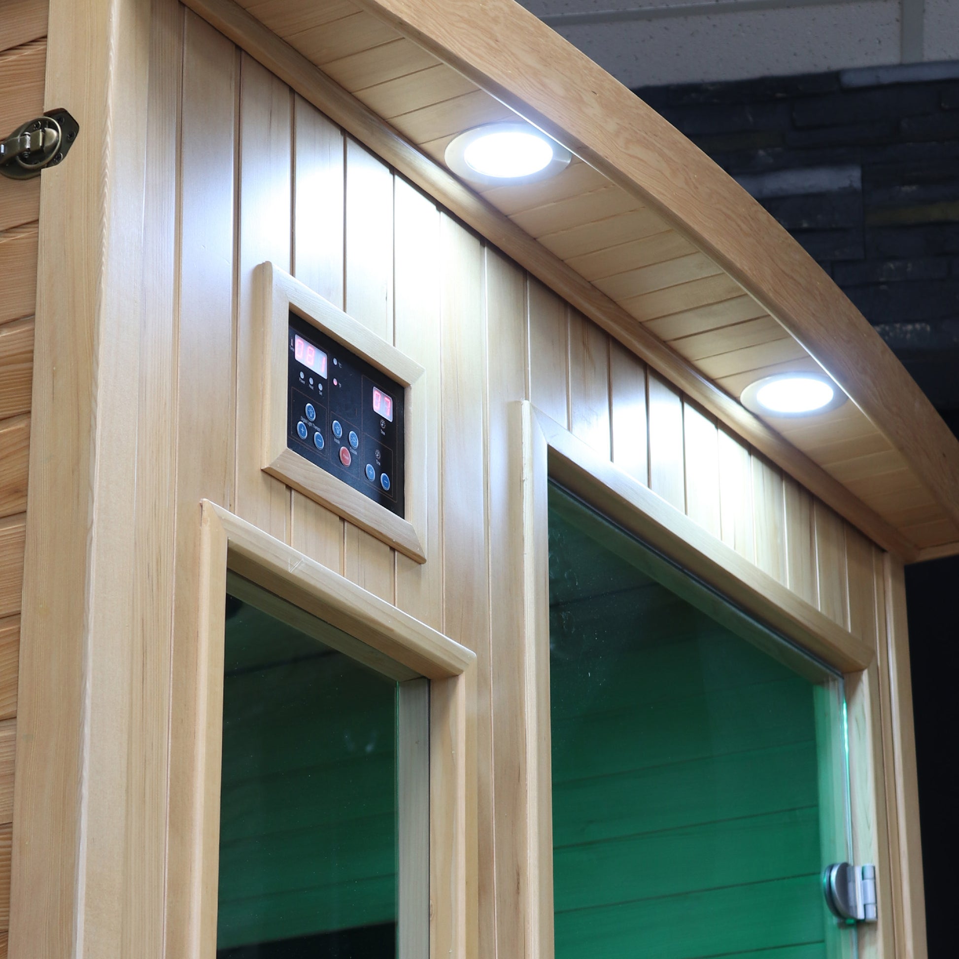 Wooden sauna with digital control panel and green interior